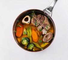 Hearty homemade beef and vegetable soup photo