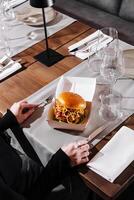 Gourmet burger in elegant dining setting photo