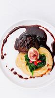 Gourmet filet mignon with fig and mashed potatoes photo