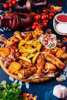 Traditional spicy roasted chicken and potatoes feast photo