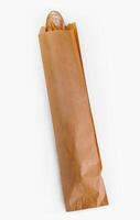Fresh baguette in a paper bag on white background photo