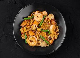 Delicious shrimp stir fry with vegetables and rice photo