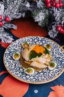 Festive jelly chicken plate with christmas decorations photo