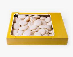 Box of traditional white sugar cookies isolated on white photo