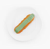 Green icing eclair on white plate photo