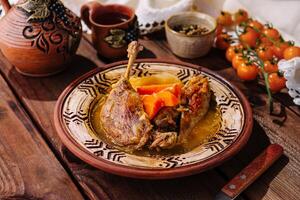 Traditional roasted duck leg with vegetables photo