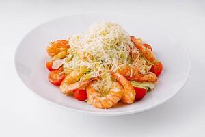 Fresh shrimp salad with grated cheese photo