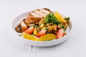 Fresh fruit salad with grilled bread slices photo