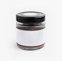 Blank label spice jar on white background photo