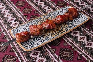 Turkish kebab on decorative plate photo