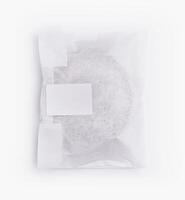 Sealed paper bag with blank label on white background photo