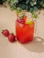 Refreshing strawberry lemonade in mason jar photo