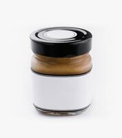 Blank label peanut butter jar on white background photo