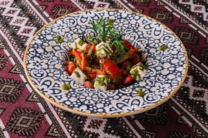 Traditional caprese salad on ornate plate photo