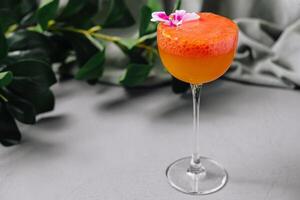 Elegant cocktail with flower garnish photo