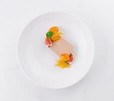 Elegant gourmet dessert presentation on white plate photo