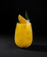 Fresh orange cocktail on dark background photo