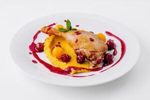 Gourmet duck confit with berry sauce photo