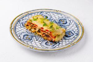 Vegetarian lasagna on decorative plate photo