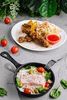Healthy gourmet meal with grilled chicken and fish photo