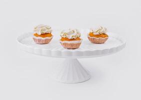 Elegant cupcakes on white stand photo