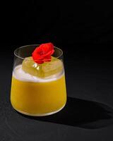 Elegant cocktail with edible flower garnish photo