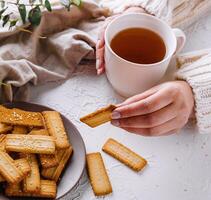 Cozy tea time with homemade biscuits photo