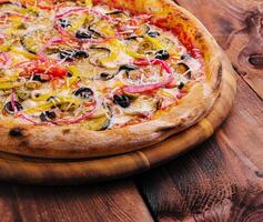 vegan pizza with eggplant, tomatoes and red onion photo