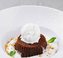 Decadent molten chocolate lava cake with vanilla ice cream photo