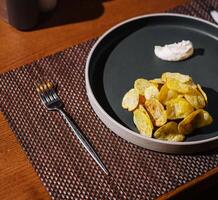 Elegant table setting with gourmet chips and dip photo