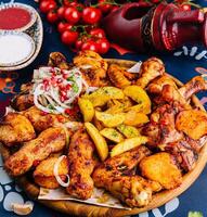 Succulent grilled chicken and potato feast photo