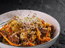 Gourmet stir-fry beef with vegetables and sprouts photo