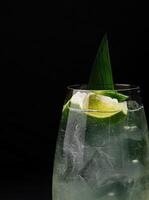 Refreshing lime cocktail on dark background photo