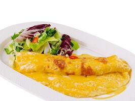 Cheesy omelette with fresh salad on white plate photo