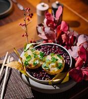 Autumnal feast - stuffed squash on bean bed photo