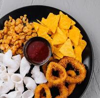 Assorted snack platter with dipping sauce photo