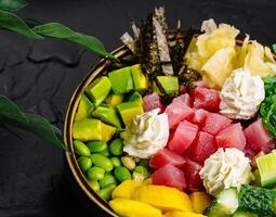 Fresh poke bowl with tuna and vegetables photo