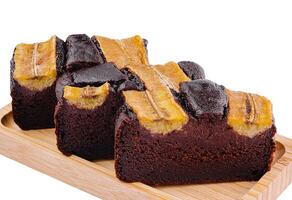 Chocolate banana bread slices on wooden board photo