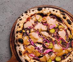 Gourmet vegan pizza on rustic table photo