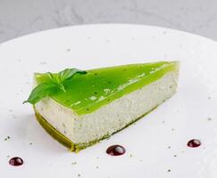 Fresh lime cheesecake slice on plate photo