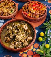 Traditional african stews in clay pots photo