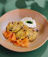 Gourmet smoked salmon with herb pancakes photo