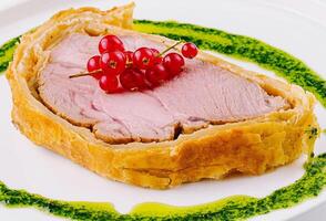 Gourmet pork tenderloin with redcurrant and pesto photo