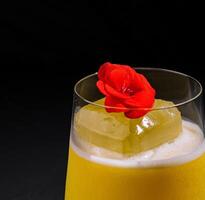 Elegant cocktail with edible flower garnish photo