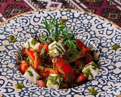 Traditional caprese salad on ornate plate photo