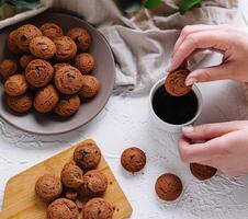 Enjoying freshly baked cookies with coffee photo