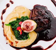 Gourmet filet mignon with fig and mashed potatoes photo