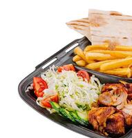 Gyro platter with fresh sides isolated on white photo