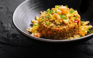 Delicious fried rice in bowl photo