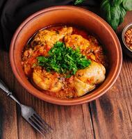 Hearty chicken stew in ceramic bowl photo